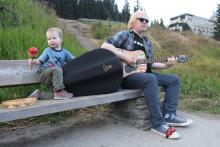 Digging around in the bag for his instrument of choice